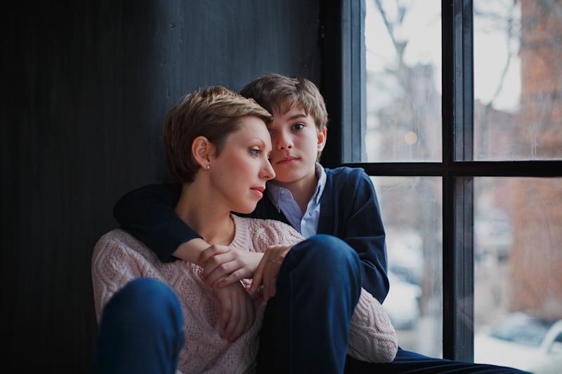 Child with parent in a hug